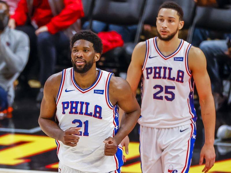 Joel Embiid (l), here with teammate Ben Simmons, has signed a four-year deal with Philadelphia.