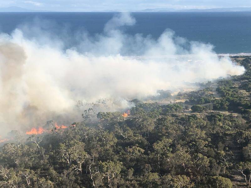 Tasmania's Fire Service is warning people to report any smoke ahead of worsening conditions.