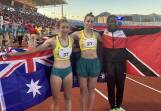 Australians Delta Amidzovski (c) and Grace Krause (l) won long jump gold and bronze at Trinbago23. (PR HANDOUT IMAGE PHOTO)