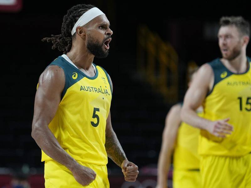 Patty Mills has scored a game-high 24 points to lead Australia to victory over Germany in Tokyo.