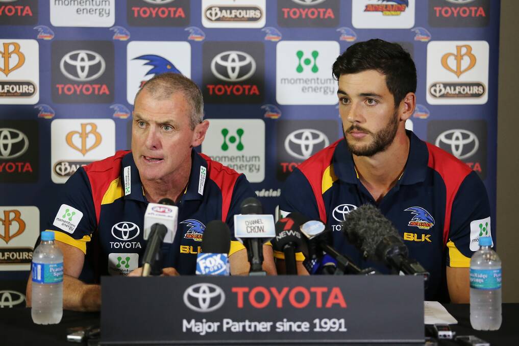 Still mad about footy: Hamilton-born Adelaide coach Phil Walsh with Crows skipper Taylor Walker. Picture: GETTY IMAGES