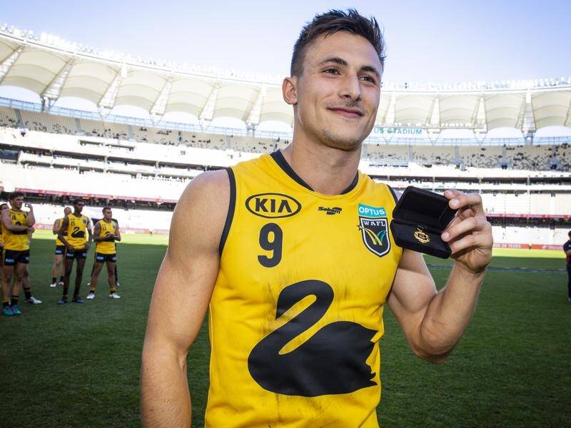 Josh Deluca, pictured with the Simpson Medal in Dockers attire last May, has been drafted by Carlton