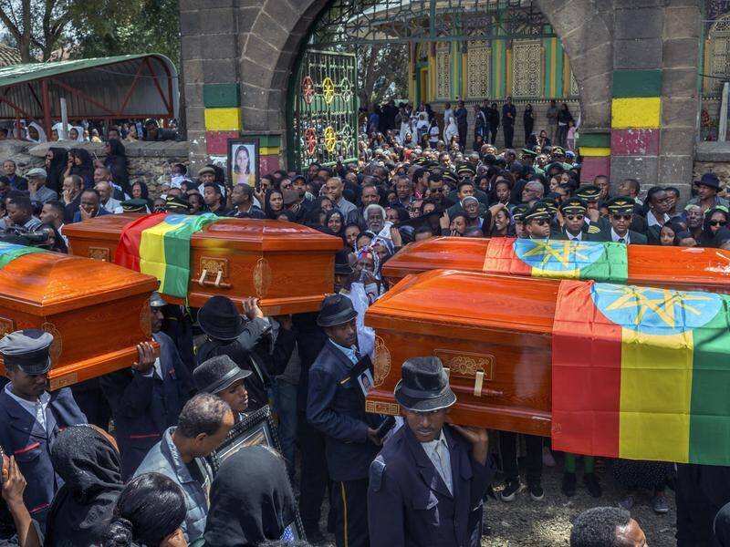 Relatives have wept over empty caskets at a mass funeral for the Ethiopian Airlines crash victims.
