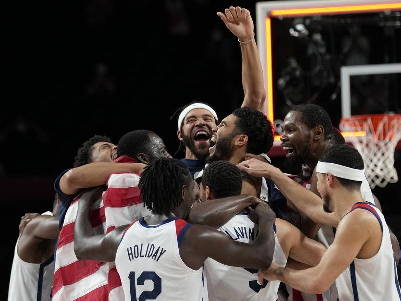 United States players celebrate their Olympic gold medal after beating France in the final.