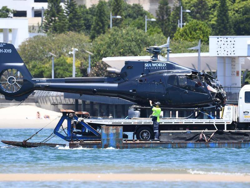 A passenger appeared to warn a helicopter pilot seconds before a deadly crash on the Gold Coast. (Jono Searle/AAP PHOTOS)