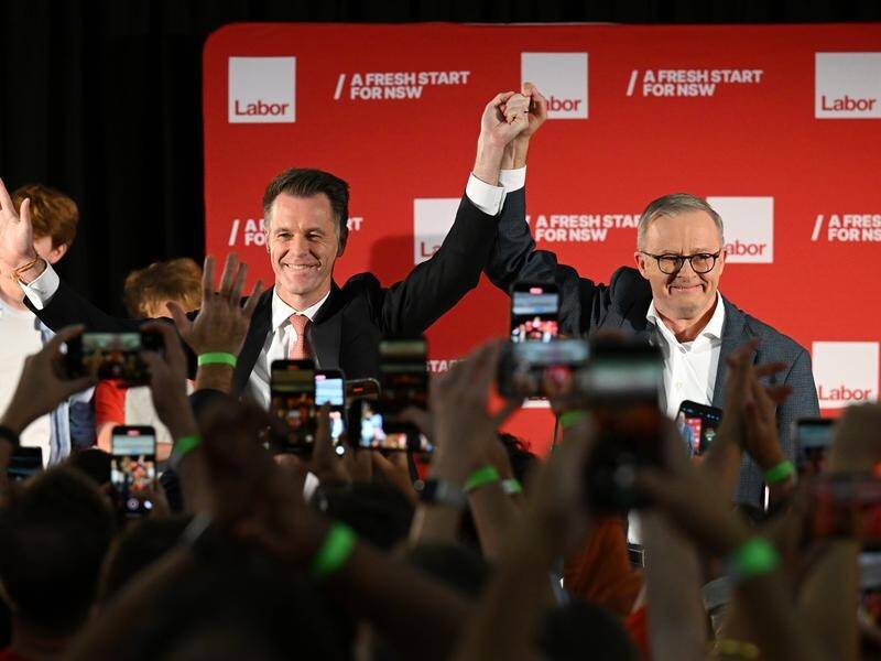 Labor's Chris Minns will be the next NSW premier, greeted in victory by Anthony Albanese. (Dean Lewins/AAP PHOTOS)