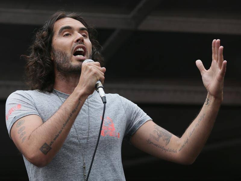 Russell Brand says he is the subject of a "litany of extremely egregious and aggressive attacks". (AP PHOTO)