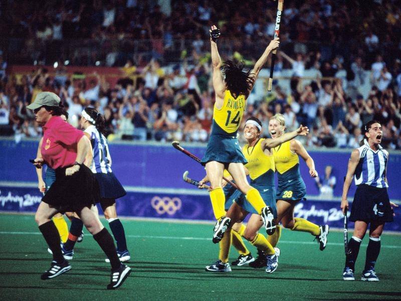 Rechelle Hawkes jumps for joy as the Hockeyroos claim gold at the Sydney Olympics.