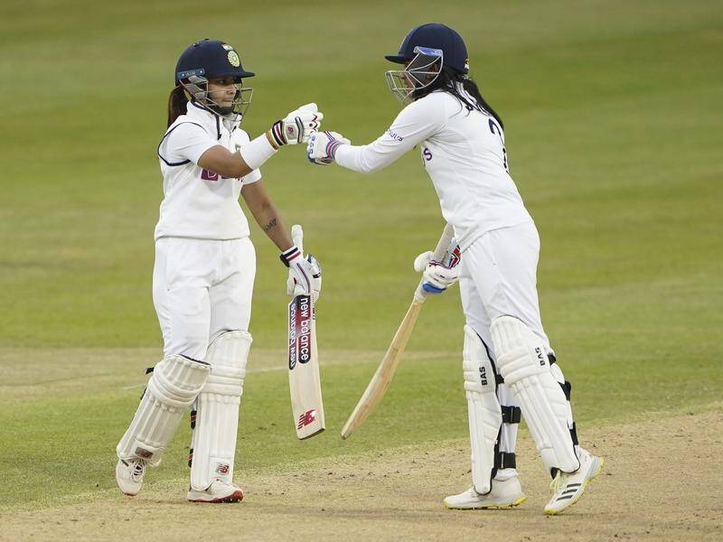 India's Taniya Bhatia (L) and Sneh Rana (R) ensured the one-off Test against England was drawn.