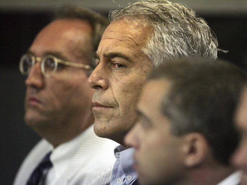 Jeffrey Epstein's (C) lawyers have asked a judge to give him house arrest in his New York mansion.