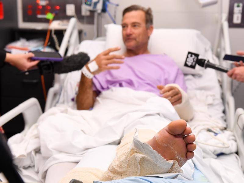 Neil Parker spent two days crawling through the Queensland bush with a broken leg and wrist.