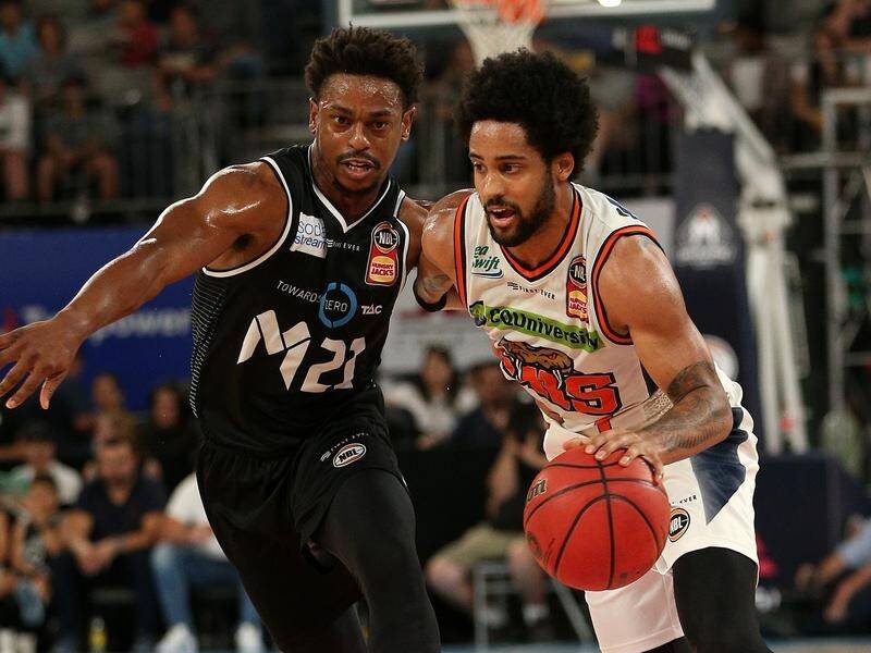 Melo Trimble (right) was prominent as the Taipans edged Melbourne 87-85 in a NBL nailbiter.