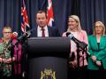 Premier Mark McGowan was flanked by his wife and ministry as he unexpectedly quit politics. (Richard Wainwright/AAP PHOTOS)