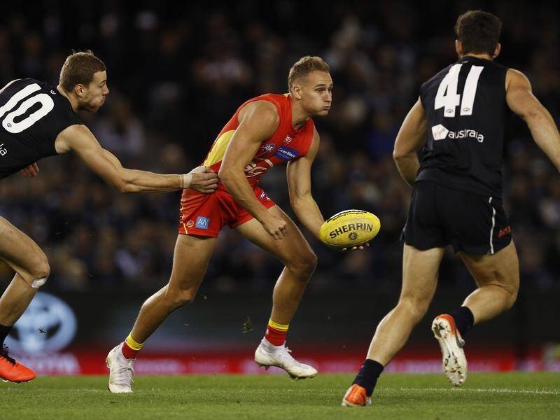 Will Brodie was injured during his strong game for the Suns in their loss to Carlton.