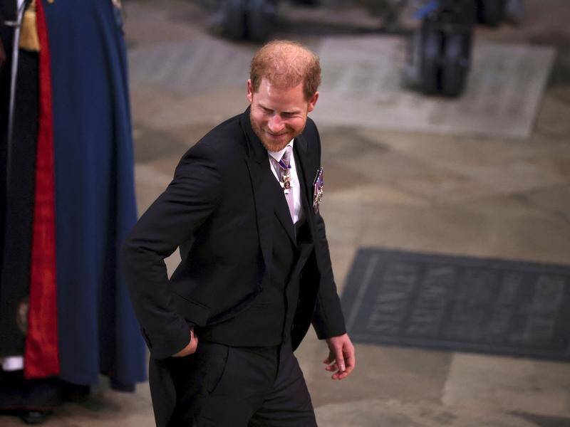 A smiling Prince Harry arrived at Westminster Abbey for the coronation of his father, King Charles. (AP PHOTO)