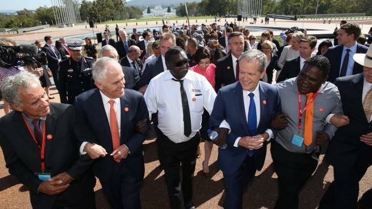 Prime Minister Malcolm Turnbull and Opposition Leader Bill Shorten came together to link arms at the No More event in support of ending family violence in Indigenous communities. Photo: Andrew Meares