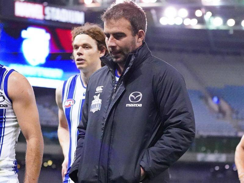 North Melbourne's Ben Cunnington (c) won't play in the AFL again this season due to a back problem.