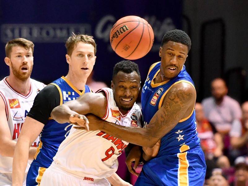 Brisbane's Lamar Patterson (right) hit form late as the Bullets beat the Hawks 98-87 in overtime.