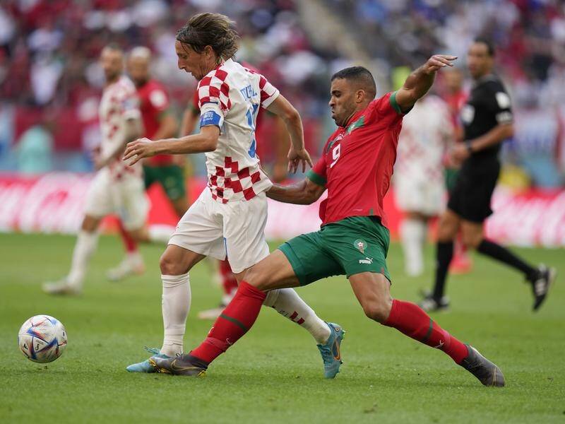Croatia's Luka Modric and Morocco's Abderrazak Hamdallah battle for the ball in their goalless draw. (AP PHOTO)