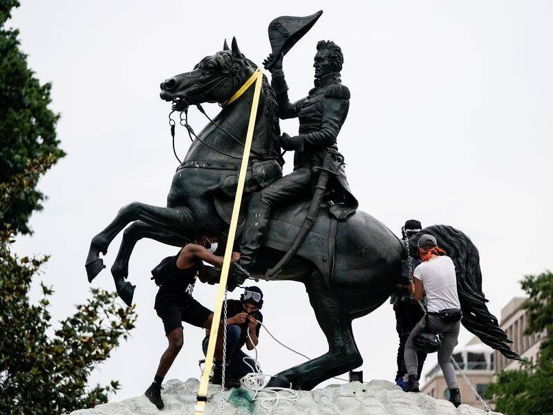 Protesters try to topple the statue of former US president Andrew Jackson outside the White House.