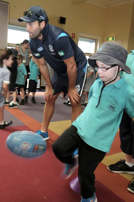Jimmy Bartel with Warrnambool West Primary School pupil Nash Childs, 7.