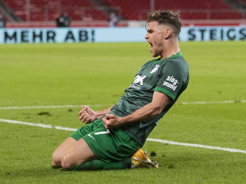 Augsburg's Florian Niederlechner celebrates his goal in the Bundesliga match against Stuttgart.