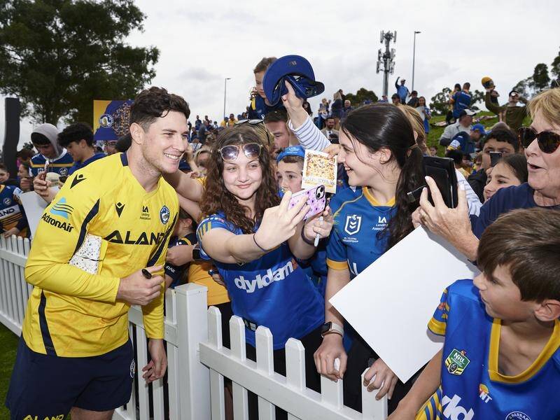 Mitch Moses, seen with Eels fans on Monday, hopes to follow fatherhood with a premiership this week. (Brett Hemmings/AAP PHOTOS)