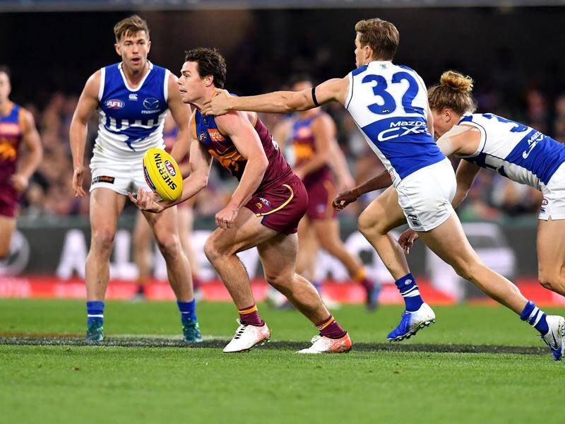 Brisbane coach Chris Fagan says the Kangaroos were all over Lachie Neale (C) from the outset.