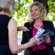 Teal candidate Melissa Lowe hands out how-to-vote cards at a pre-polling station at Camberwell. (Diego Fedele/AAP PHOTOS)