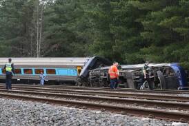 Driver John Kennedy and rail worker Sam Meintanis were killed in a derailment near Wallan. (David Crosling/AAP PHOTOS)