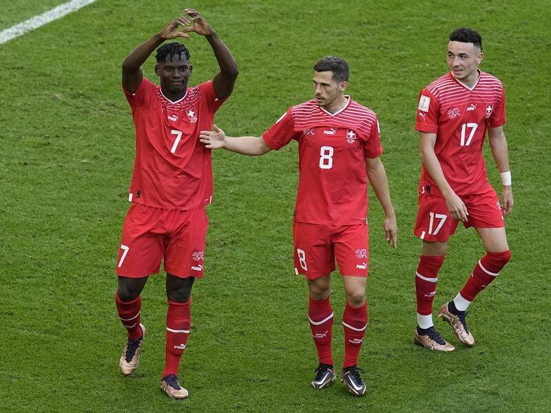 Swiss striker Breel Embolo (l) was muted in his goal celebration against Cameroon. (AP PHOTO)