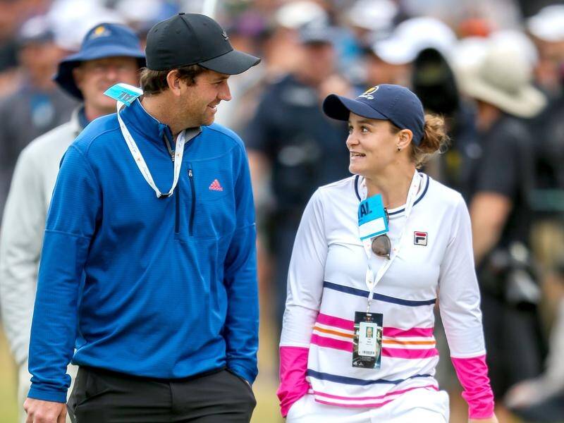 Ash Barty, seen here with fellow Australian Adam Scott at the 2019 Presidents Cup, is a keen golfer.