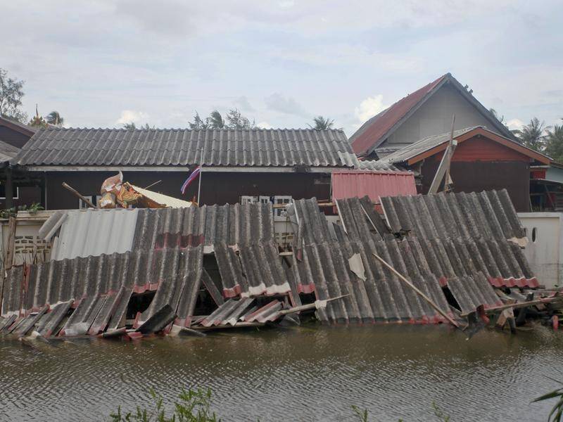 The storm damaged buildings and caused flooding in Pak Phanang, southern Thailand.