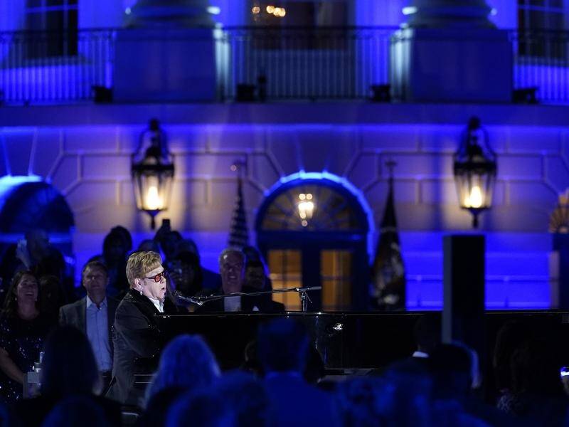 Elton John is tidal wave to help people rise up and make hope and history rhyme, Joe Biden says. (AP PHOTO)