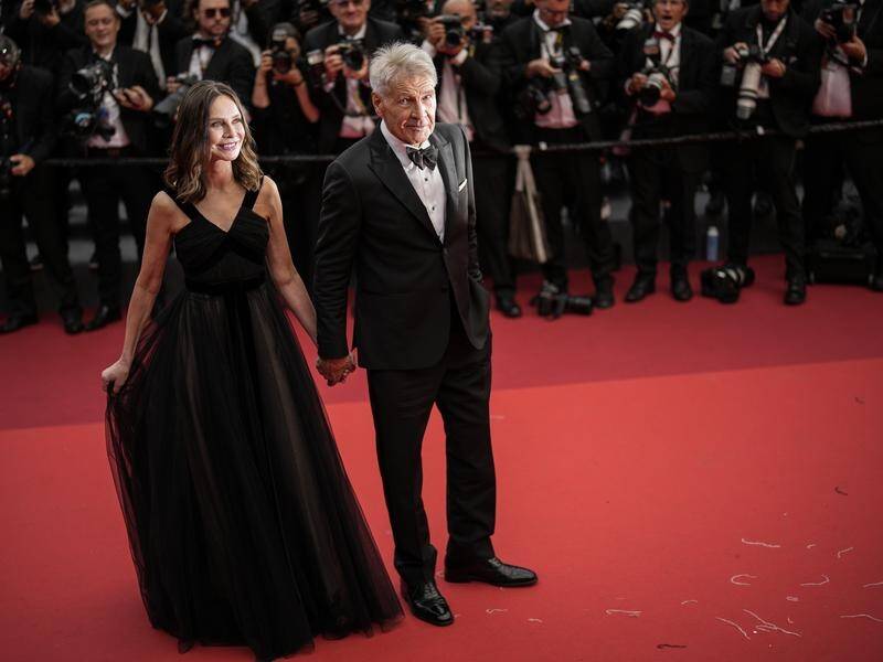 Calista Flockhart and Harrison Ford have posed for photographers at the 76th Cannes film festival. (AP PHOTO)