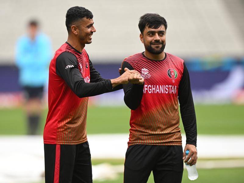Mujeeb Ur Rahman (l) and skipper Rashid Khan have led Afghanistan to a first T20 win over Pakistan. (James Ross/AAP PHOTOS)