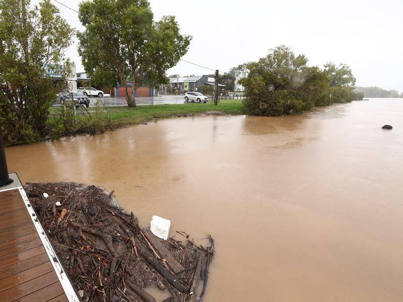 A five-year-old child has been found dead inside a car that was swept away by floodwaters in NSW. (JASON O'BRIEN/AAP PHOTOS)