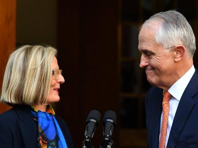 Malcolm and Lucy Turnbull, at his farewell press conference, have returned to Sydney from overseas.