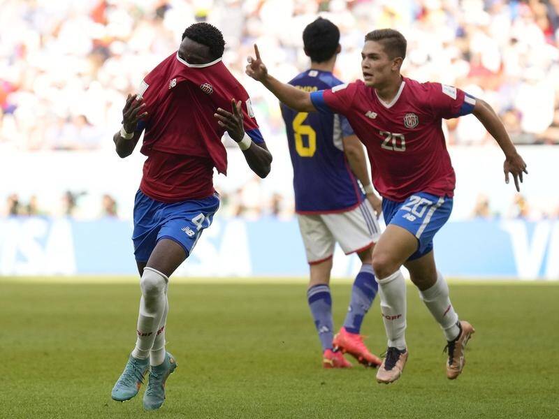 Costa Rica's Keysher Fuller, left, celebrates after scoring his side's winner against Japan. (AP PHOTO)