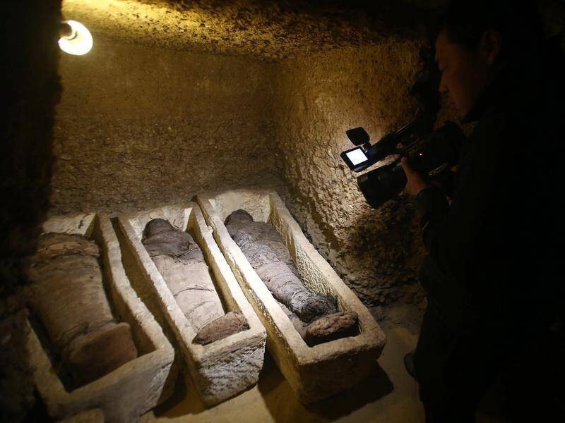 Egyptian archaeologists have uncovered a Pharaonic tomb containing 50 mummies.