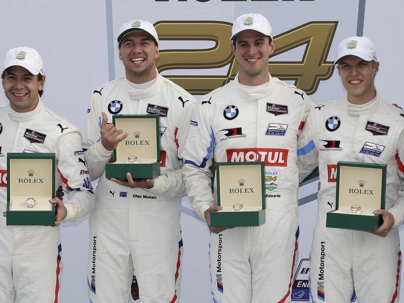 Supercars star Chaz Mostert (l) celebrates Daytona 24 hour race success with his BMW teammates.