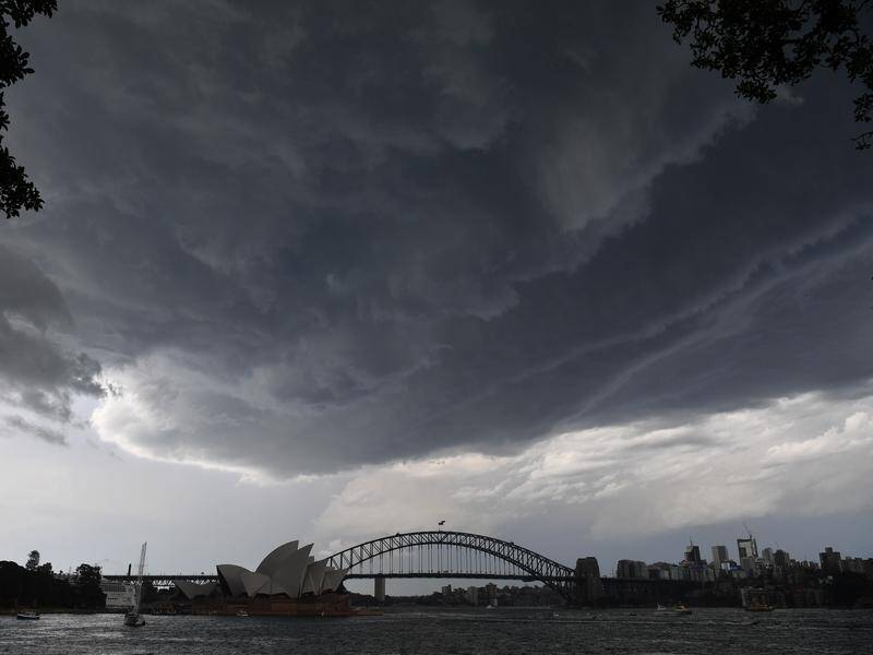 Dark storm clouds have delivered hail and heavy rain across Sydney and beyond.