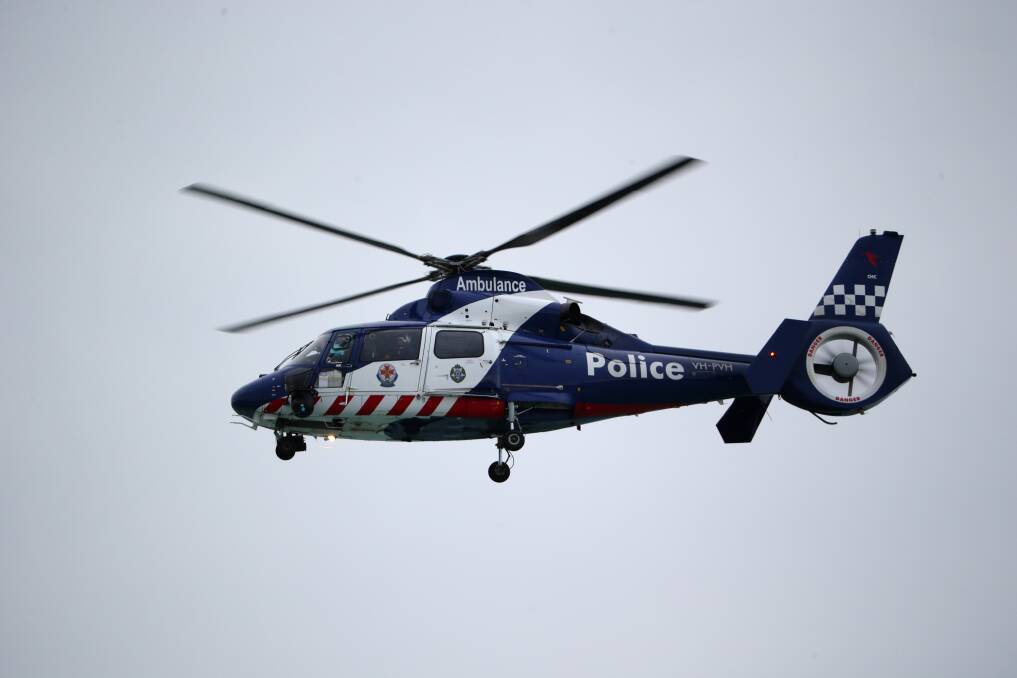 The police helicopter takes to the skies over Port Fairy. Picture: DAMIAN WHITE