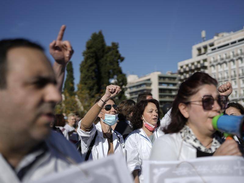Protests against mandatory vaccination rules have drawn crowds of thousands in Greece.