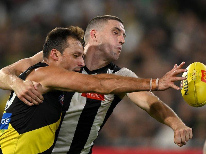 Collingwood's Darcy Cameron (right) will be out for months after injuring his knee against Richmond. (Morgan Hancock/AAP PHOTOS)
