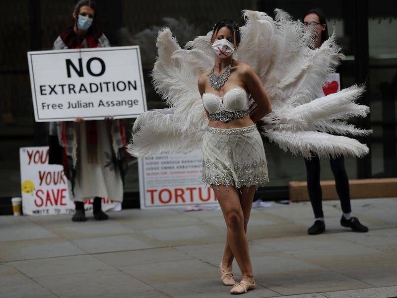 A dancer performs in protest at London's Old Bailey during Julian Assange's extradition trial.