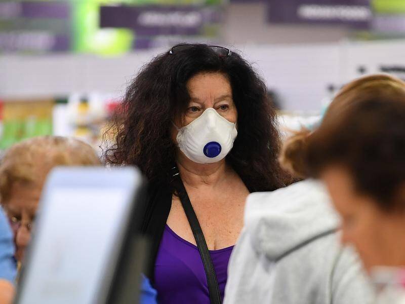Residents in locked-down areas of Melbourne have been urged to wear masks when they leave home.