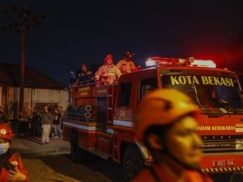 Firefighters have extinguished a massive fire at a military ammunition facility in Bogor, Indonesia. (EPA PHOTO)