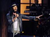 Comedian Russell Brand has denied allegations of sexual assault made by four women in media reports. (AP PHOTO)