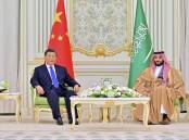 Chinese President Xi Jinping has told Saudi Crown Prince Mohammed bin Salman he wants closer ties. (AP PHOTO)